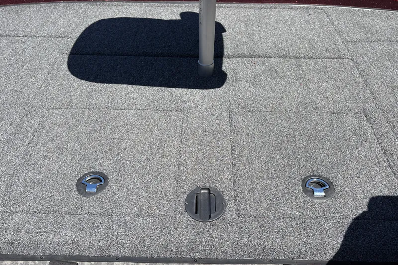 Slide: The Image of Carpeted deck of 2026 Nitro Z21 XL Pro boat with metal fixtures. - 42