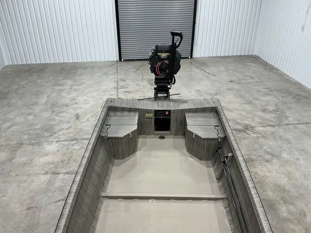 Slide: The Image of 2026 Gator Tail 1754 Extreme Rear Dual Pods boat in a garage setting. - 6