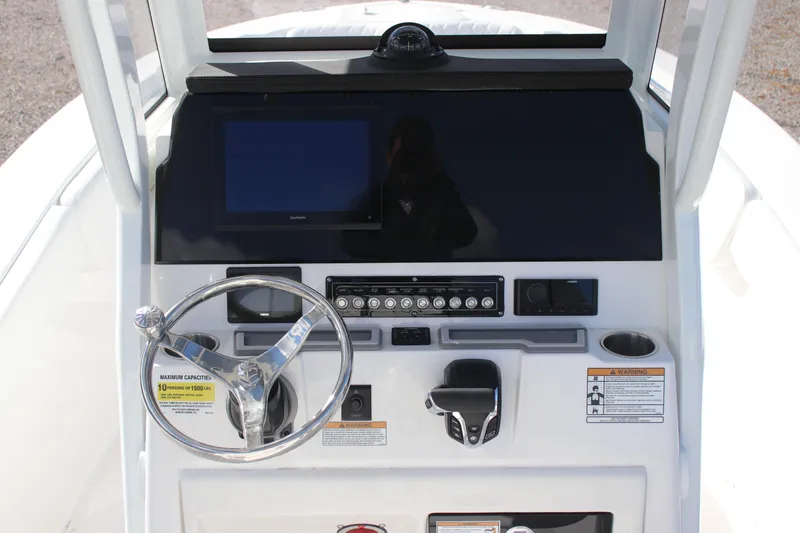 Slide: The Image of 2026 Sea Fox 248 Commander boat dashboard with steering wheel and control panel. - 5