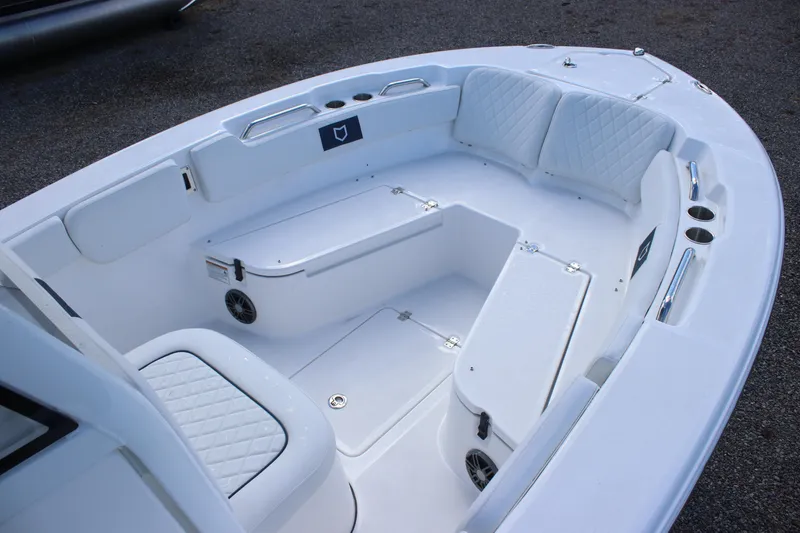 Slide: The Image of 2026 Sea Fox 248 Commander boat interior with white seating and storage compartments. - 7