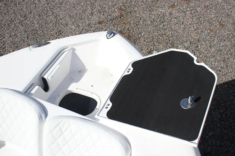 Slide: The Image of 2026 Sea Fox 248 Commander boat interior with seating and table setup. - 10