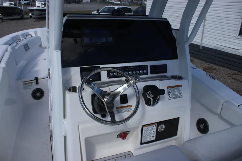 Slide: The Image of 2026 Sea Fox 248 Commander boat dashboard with steering wheel and controls. - 13