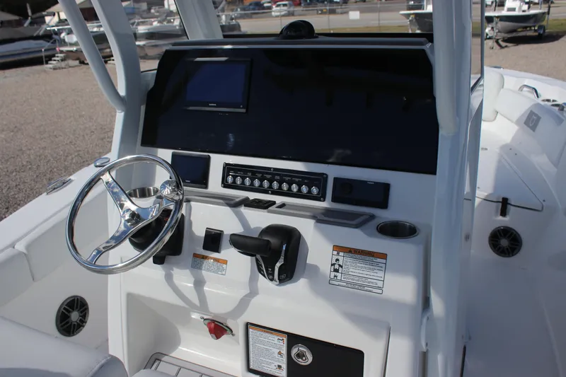 Slide: The Image of 2026 Sea Fox 248 Commander boat dashboard with steering wheel and controls. - 14