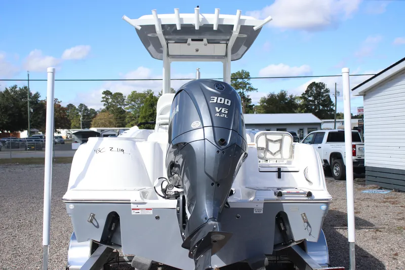 Slide: The Image of 2026 Sea Fox 248 Commander boat with Yamaha 300 V6 engine, parked outdoors. - 4
