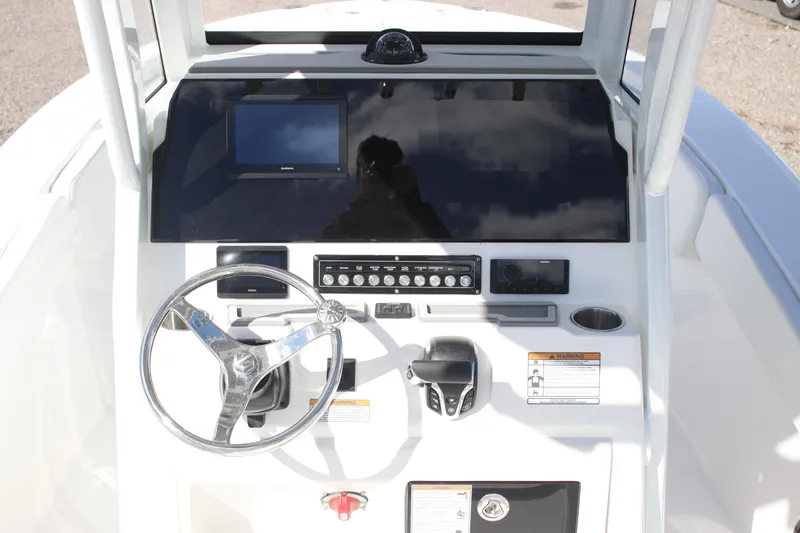 Slide: The Image of 2026 Sea Fox 248 Commander boat dashboard with steering wheel and control panel. - 6