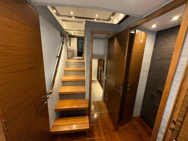 Slide: The Image of Interior of 2020 Tiara Yachts F53 Flybridge with wooden stairs and modern design. - 16