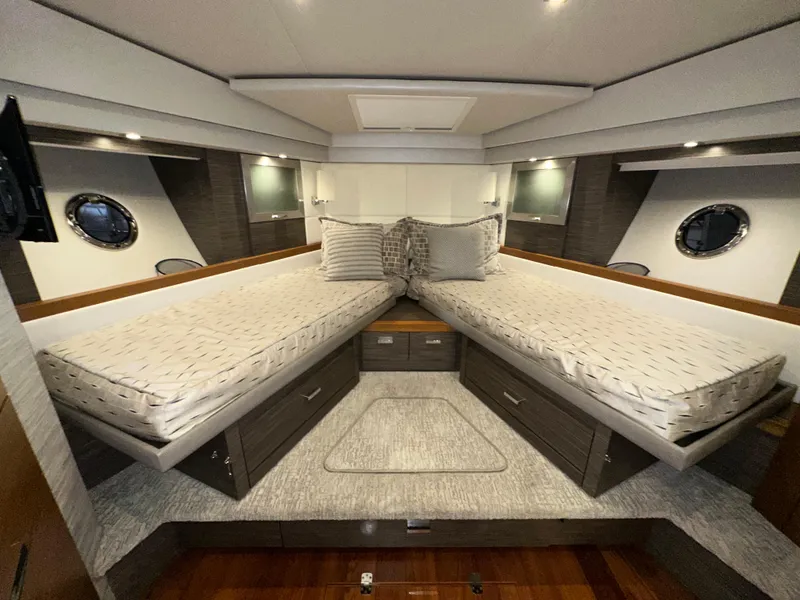 Slide: The Image of Luxurious 2020 Tiara Yachts F53 Flybridge cabin interior with twin beds and modern design. - 18