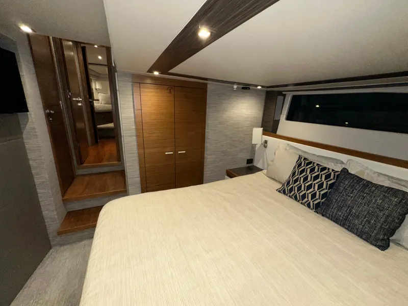 Slide: The Image of Luxurious bedroom interior of 2020 Tiara Yachts F53 Flybridge with modern design and cozy bedding. - 26