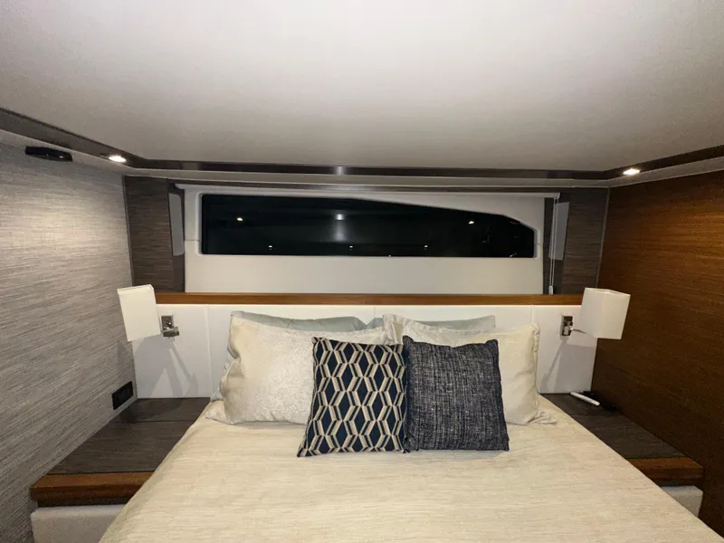 Slide: The Image of Luxurious bedroom interior of 2020 Tiara Yachts F53 Flybridge with modern design and elegant bedding. - 28