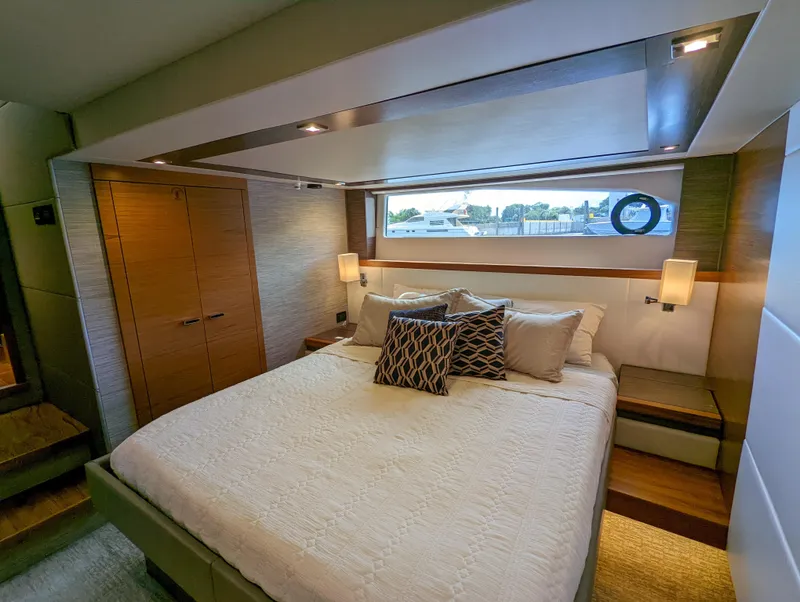 Slide: The Image of Luxurious bedroom in 2020 Tiara Yachts F53 Flybridge with modern decor and ample natural light. - 31