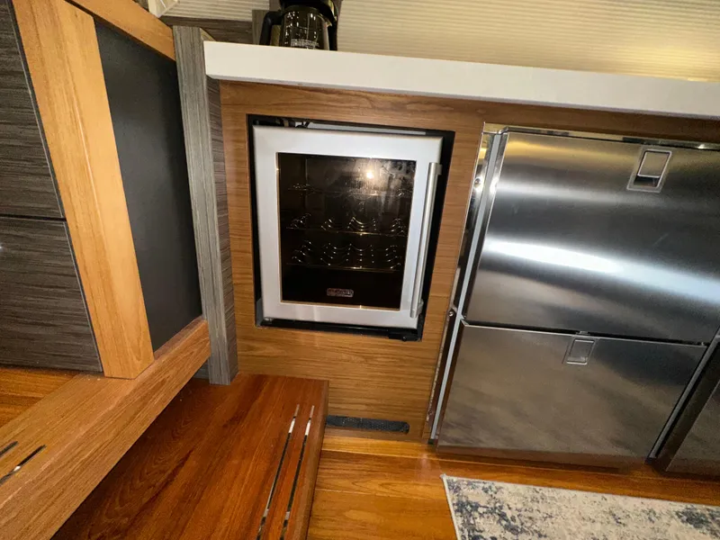 Slide: The Image of Interior of 2020 Tiara Yachts F53 Flybridge with modern kitchen appliances. - 44