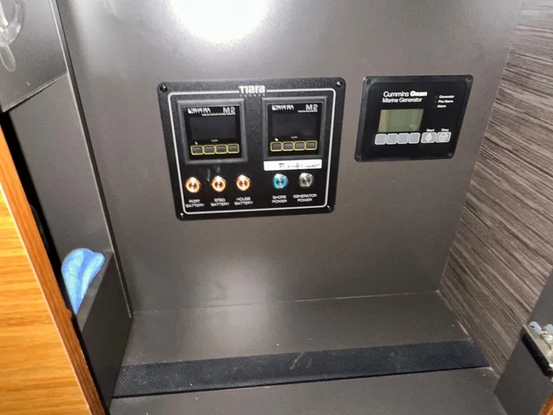 Slide: The Image of Control panel of a 2020 Tiara Yachts F53 Flybridge with Cummins Onan Marine Generator. - 45