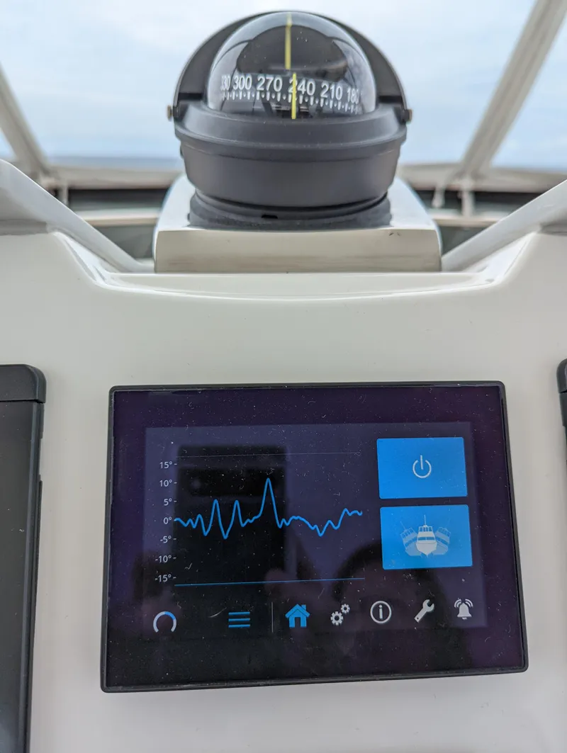 Slide: The Image of Compass and control panel on 2020 Tiara Yachts F53 Flybridge. - 48