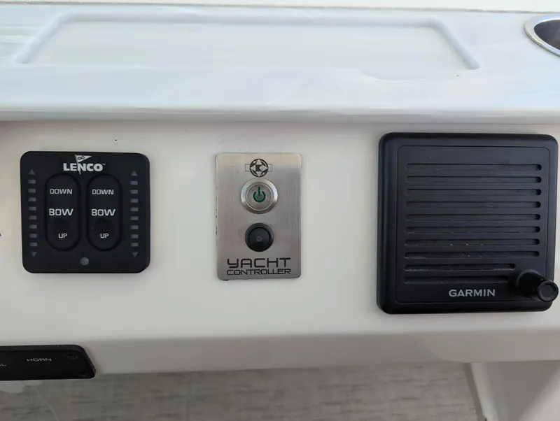 Slide: The Image of Control panel of 2020 Tiara Yachts F53 Flybridge with Lenco, Yacht Controller, and Garmin. - 49
