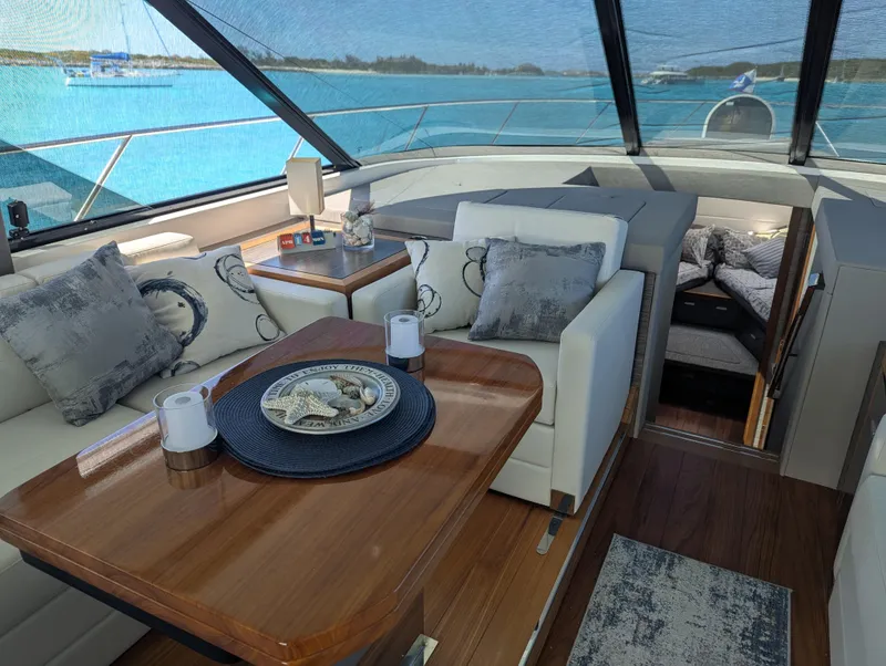 Slide: The Image of Luxurious interior of 2020 Tiara Yachts F53 Flybridge with elegant seating and ocean view. - 6