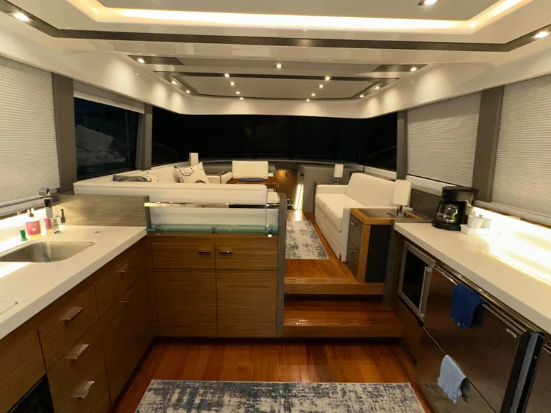 Slide: The Image of Luxurious interior of 2020 Tiara Yachts F53 Flybridge with modern kitchen and seating area. - 7