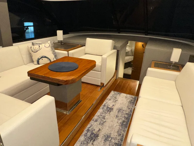 Slide: The Image of Luxurious interior of 2020 Tiara Yachts F53 Flybridge with elegant seating and wooden table. - 8