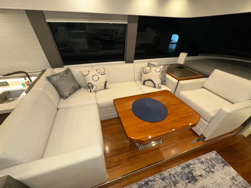 Slide: The Image of Luxurious interior of 2020 Tiara Yachts F53 Flybridge with elegant seating and wooden table. - 9