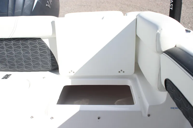 Slide: The Image of 2026 Tidewater 220 LXF boat interior with cushioned seating and storage compartment. - 17