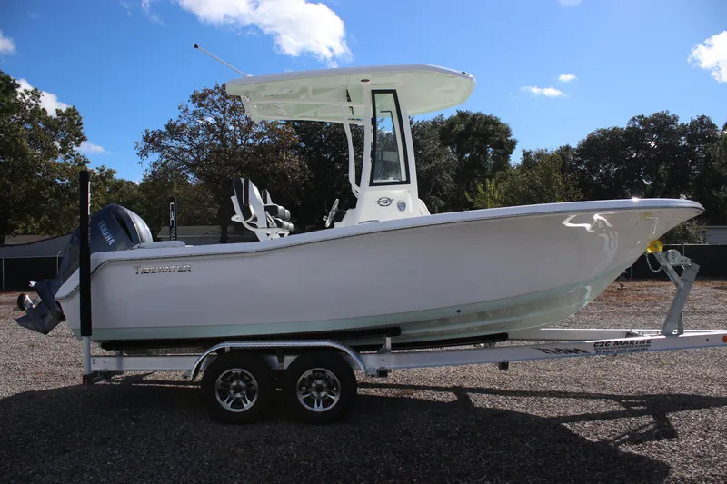 Slide: The Image of 2026 Tidewater 220 LXF boat on trailer, side view, outdoors. - 4