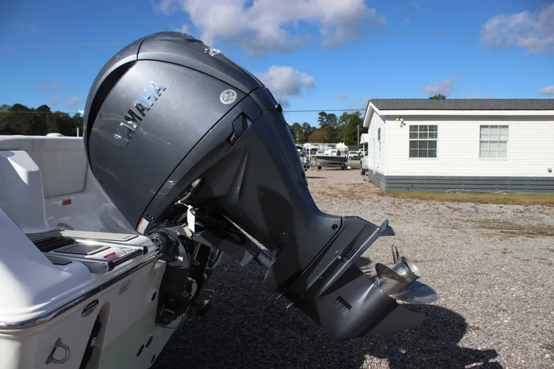 Slide: The Image of 2026 Tidewater 220 LXF boat with Yamaha outboard motor in a sunny outdoor setting. - 6