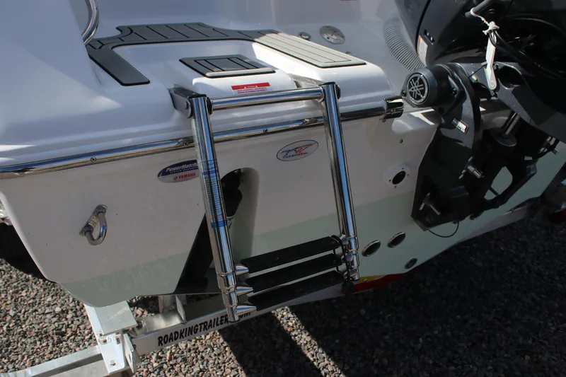 Slide: The Image of 2026 Tidewater 220 LXF boat with ladder and Yamaha engine, on Road King trailer. - 7