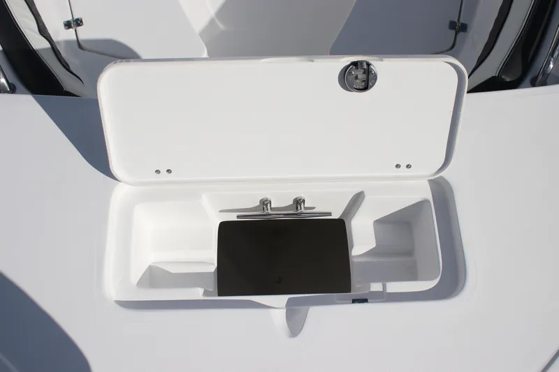 Slide: The Image of Open storage compartment on 2026 Tidewater 220 LXF boat deck. - 9