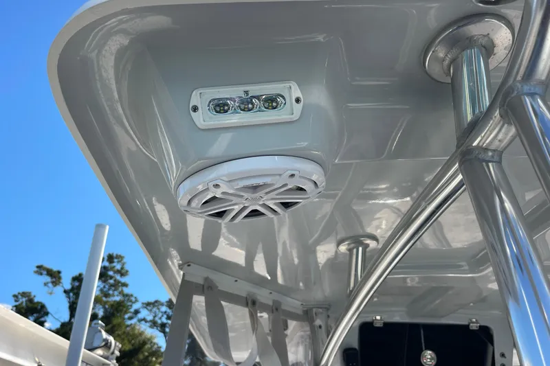 Slide: The Image of 2023 Pair Customs 24 Center Console DV boat with speaker and LED light detail. - 27