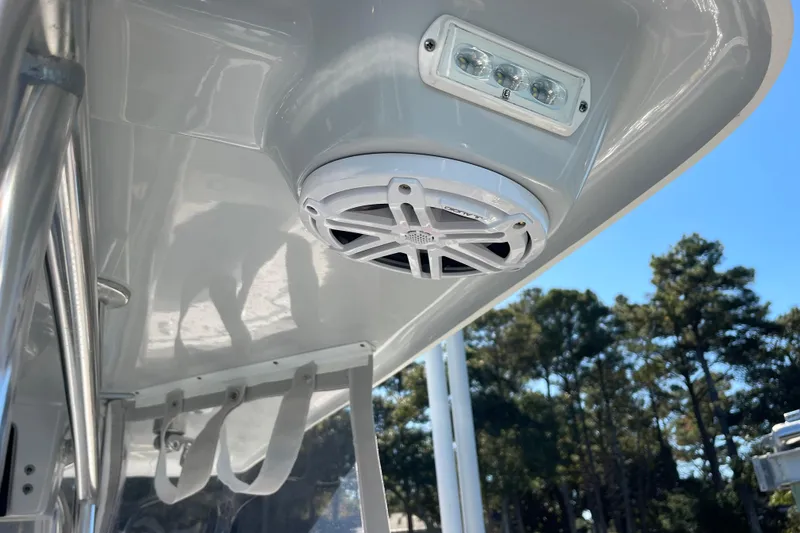 Slide: The Image of 2023 Pair Customs 24 Center Console DV boat interior with speaker and LED light. - 28