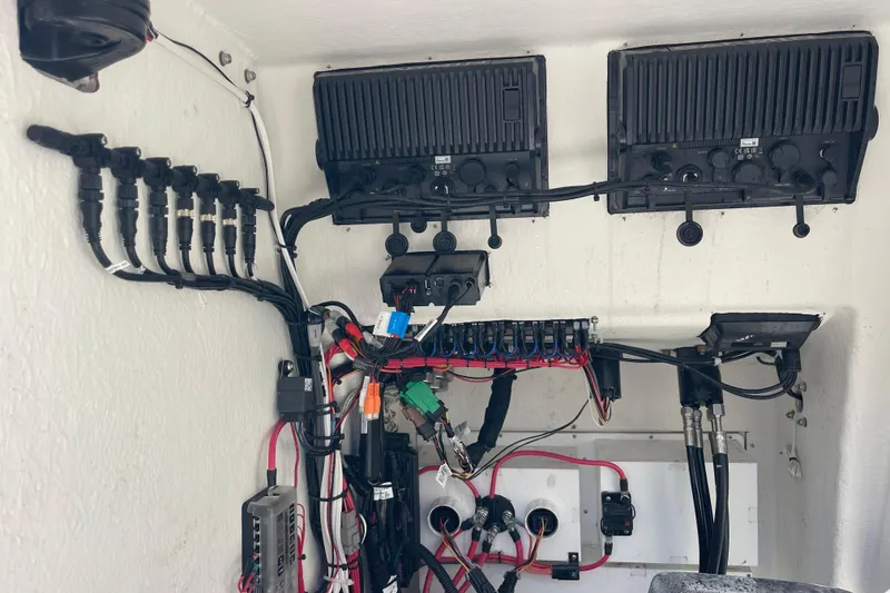 Slide: The Image of Electrical wiring and components inside a 2023 Pair Customs 24 Center Console DV boat. - 33