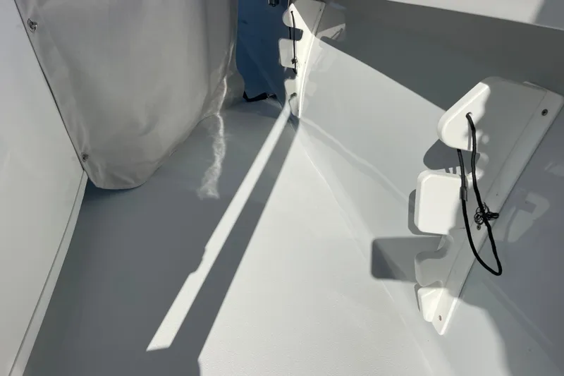 Slide: The Image of 2023 Pair Customs 24 Center Console DV interior detail with sunlight and shadows. - 35