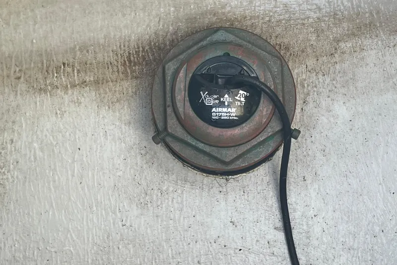 Slide: The Image of Airmar transducer on 2023 Pair Customs 24 Center Console DV boat hull. - 38