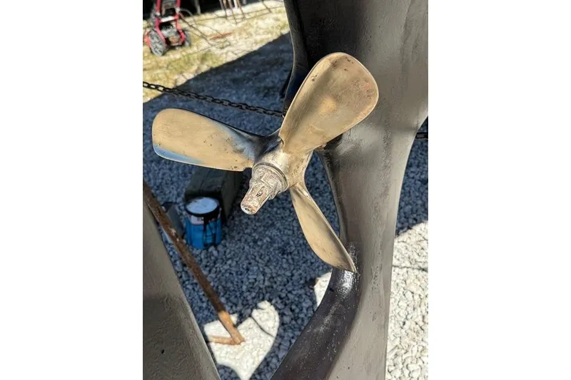 Slide: The Image of Propeller of 1989 Pacific Seacraft 34 sailboat on gravel surface. - 14