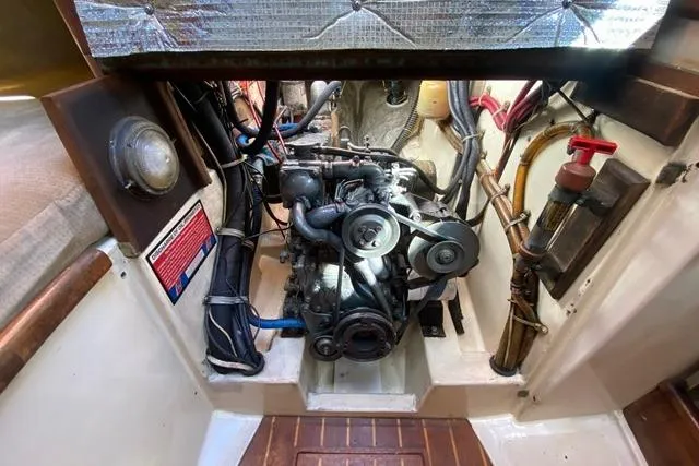 Slide: The Image of Engine compartment of a 1989 Pacific Seacraft Crealock sailboat, showcasing mechanical components. - 32