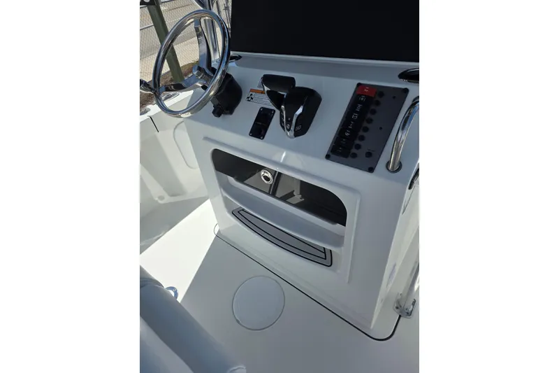 Slide: The Image of Helm of 2026 Parker 210 Coastal boat with steering wheel and control panel. - 13