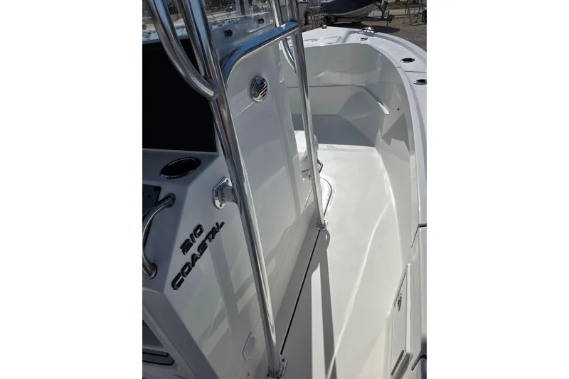Slide: The Image of 2026 Parker 210 Coastal boat interior with sleek white design and stainless steel details. - 14