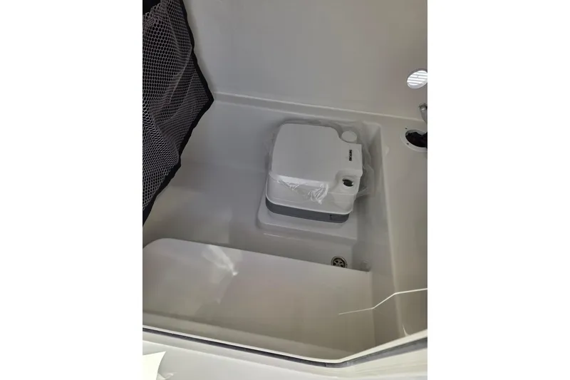 Slide: The Image of Portable toilet in 2026 Parker 210 Coastal boat interior. - 17