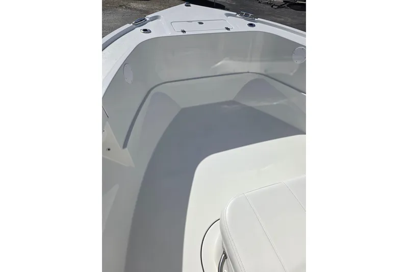 Slide: The Image of 2026 Parker 210 Coastal boat interior with white seating and spacious deck. - 19