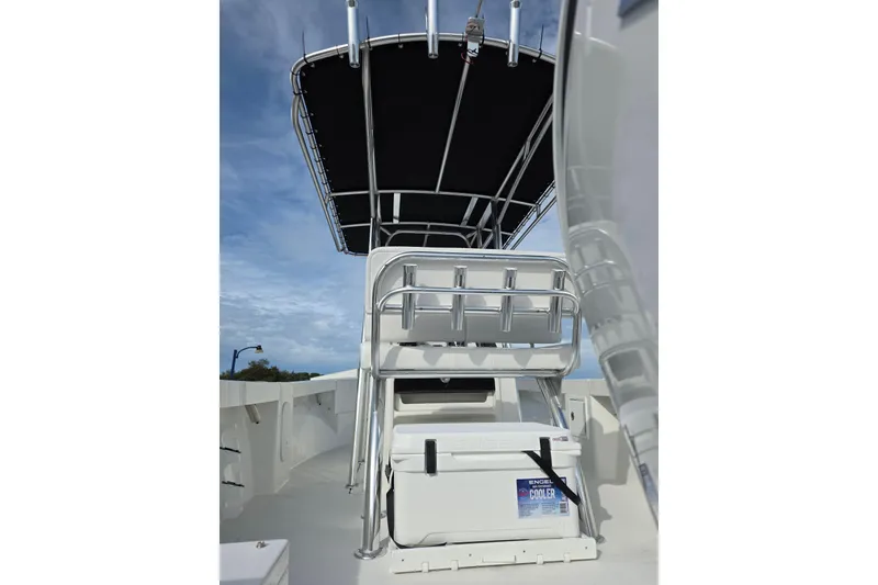 Slide: The Image of 2026 Parker 210 Coastal boat with T-top and cooler on deck. - 6