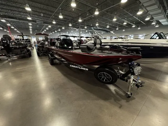 Slide: The Image of 2025 Crestliner XFC 179 boat displayed in a showroom, featuring sleek design and modern amenities. - 2