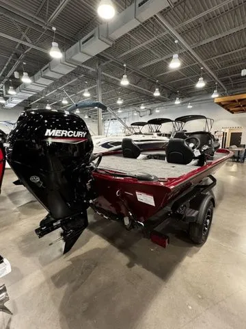Slide: The Image of 2025 Crestliner XFC 179 boat with Mercury engine in showroom. - 3