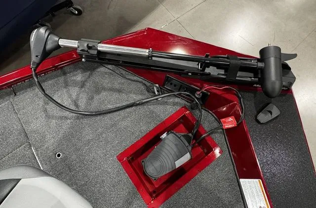 Slide: The Image of 2025 Crestliner XFC 179 boat deck with trolling motor and foot pedal controls. - 9