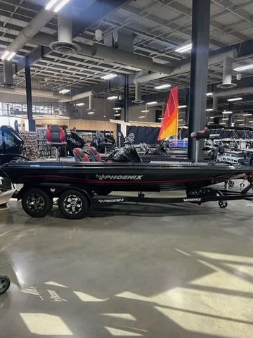 The Image of 2024 Phoenix Bass Boats 919 Elite on display in a showroom. - 1