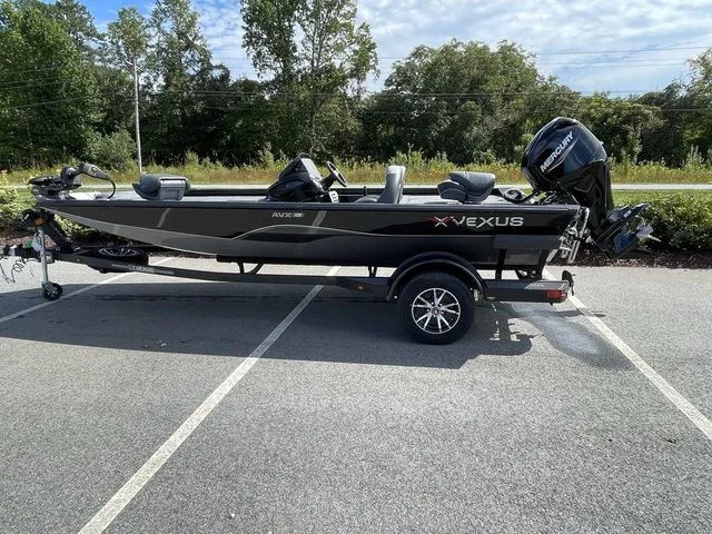 The Image of 2023 Vexus AVX181 boat on trailer in parking lot, side view. - 1