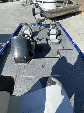 Slide: The Image of 2023 Crestliner XFC 179 boat interior with dual seats and steering console. - 11