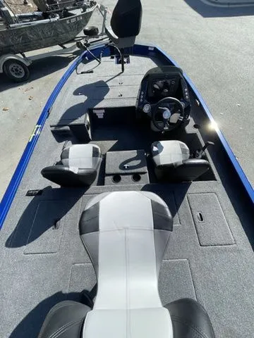 Slide: The Image of 2023 Crestliner XFC 179 boat interior with seating and steering console. - 4