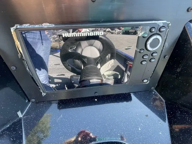 Slide: The Image of 2023 Crestliner XFC 179 boat dashboard with Humminbird fishfinder display. - 7