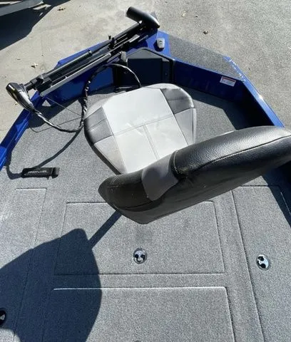 Slide: The Image of 2023 Crestliner XFC 179 boat interior with swivel seat and carpeted deck. - 9