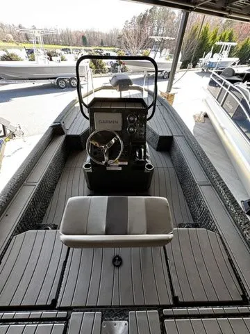 Slide: The Image of 2025 Vexus ACX2150 boat interior with Garmin console and sleek seating. - 4