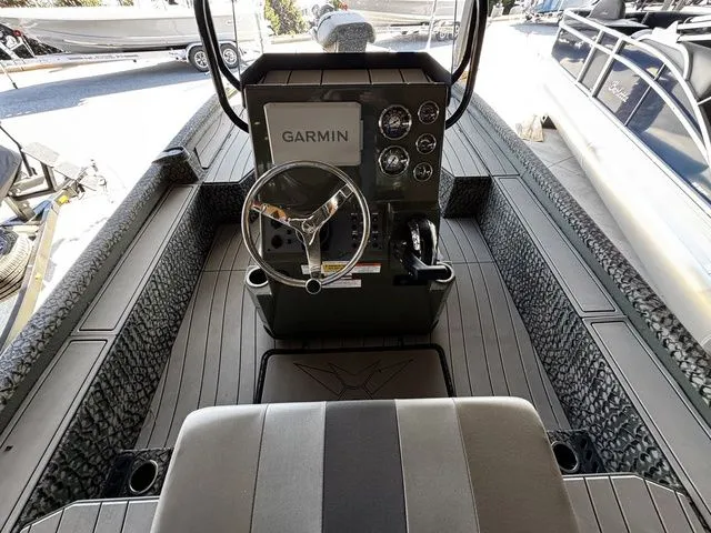 Slide: The Image of 2025 Vexus ACX2150 boat interior with Garmin navigation system and steering console. - 5